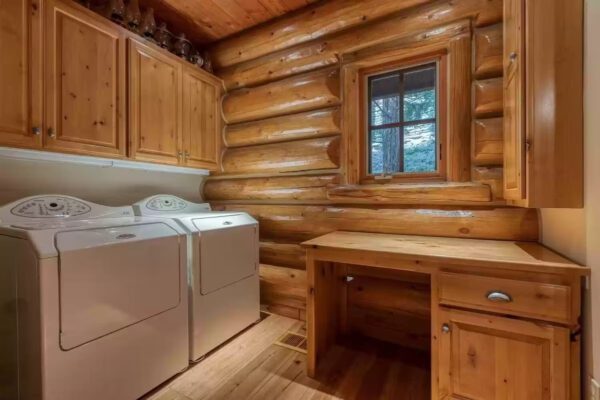 A room with wood paneling and a desk.