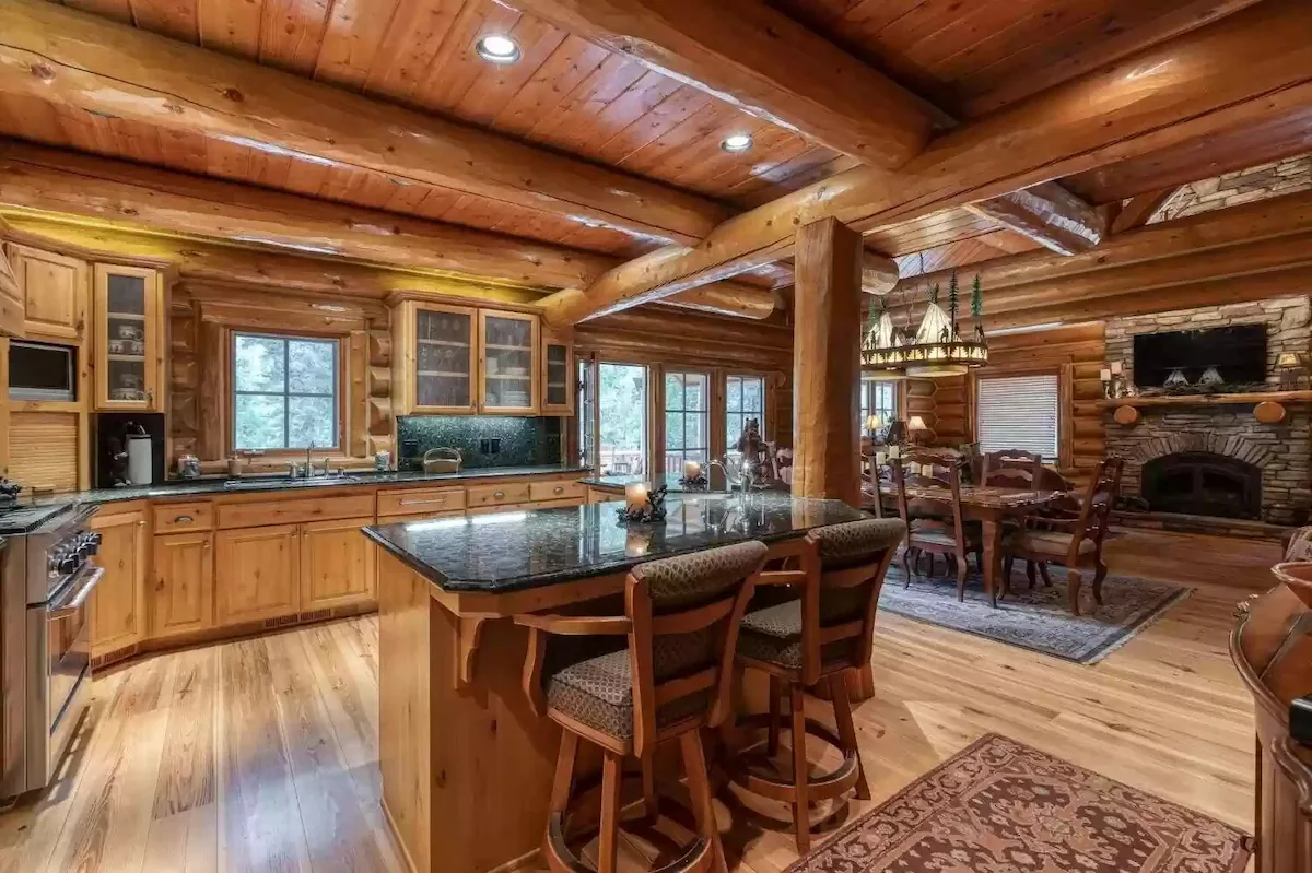 A kitchen with wooden floors and walls.