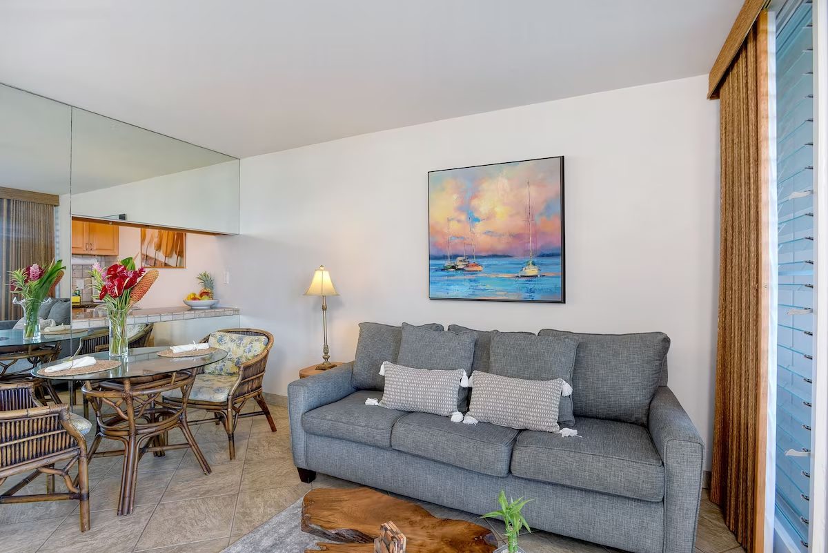 A living room with a couch and table in it