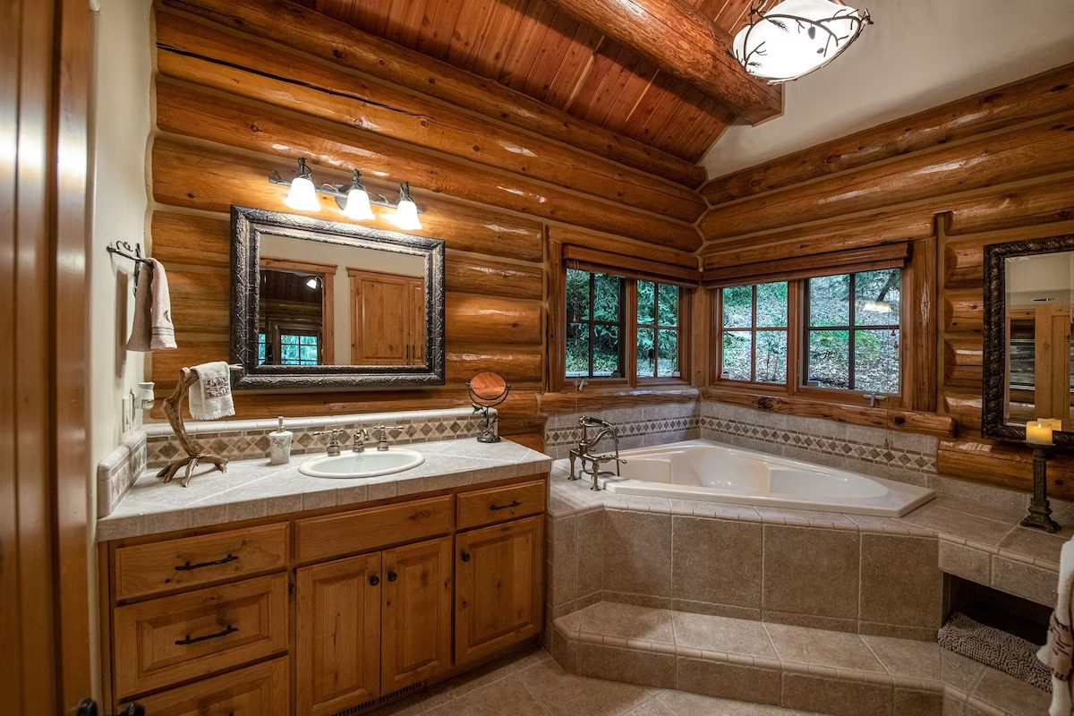 A bathroom with a large tub and sink.