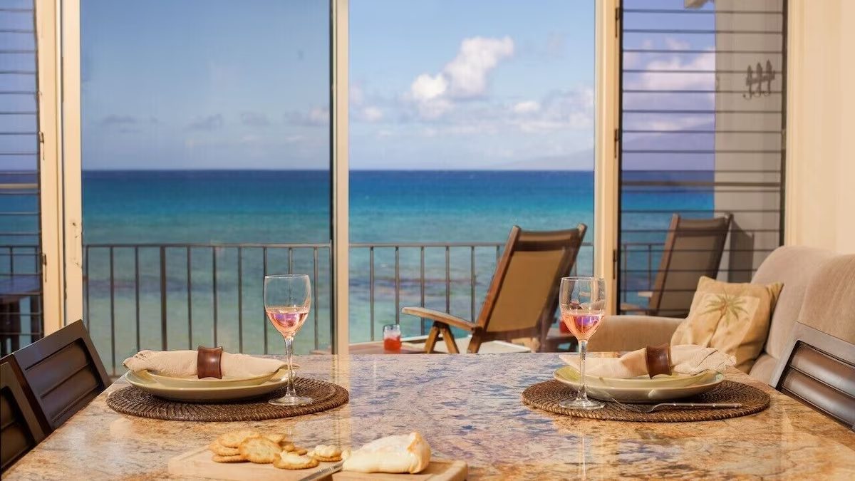 A table with two chairs and plates on it