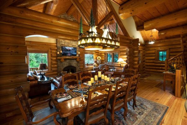 A large dining room with a table and chairs.