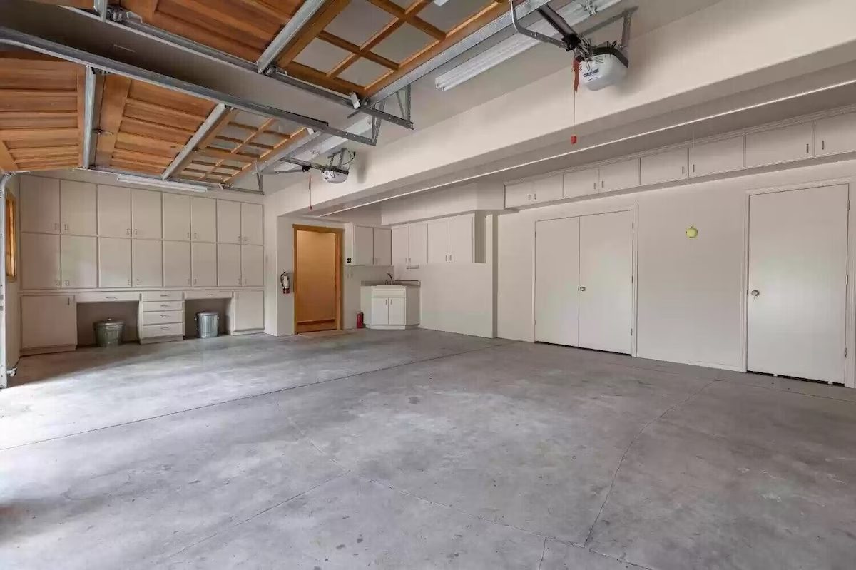 A garage with concrete floors and white walls.