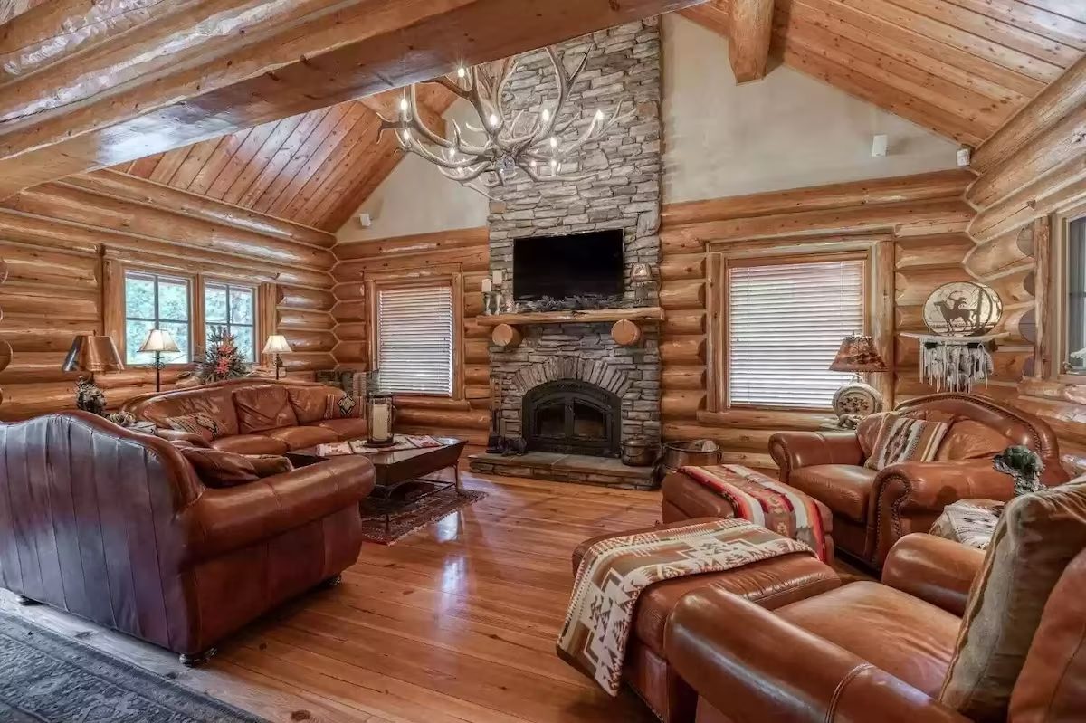 A living room with wood floors and furniture.