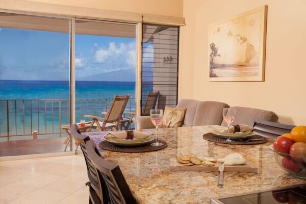 A dining room table with chairs and a glass top.