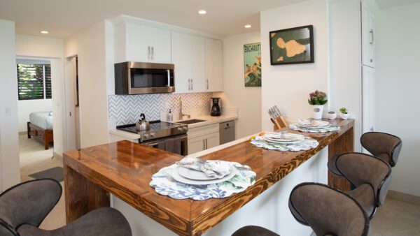 A kitchen with a table and chairs in it