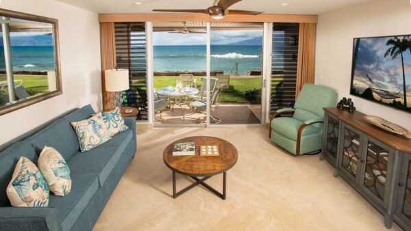 A living room with a couch, chair and table.