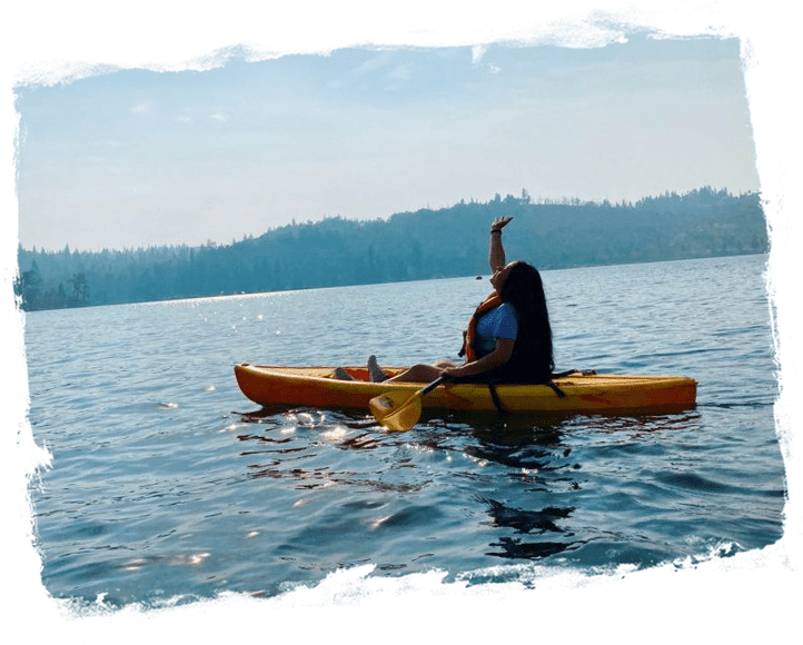 A person in a kayak on the water.