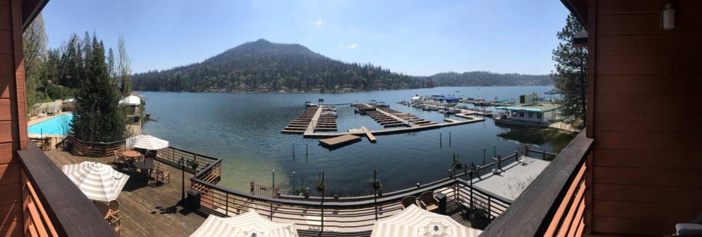 A view of a lake with many boats in it.